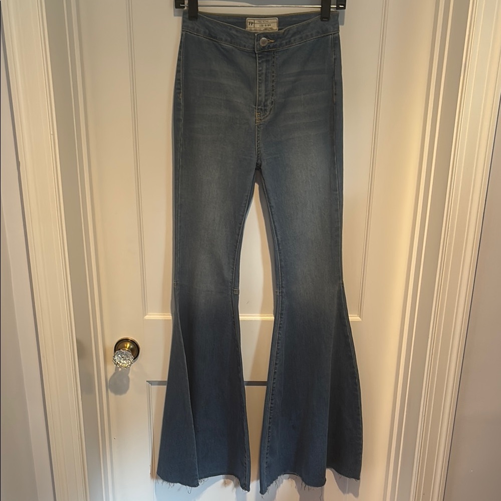 Free People extra wide flare distressed jeans with raw hem
